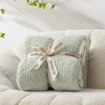 sage green heather knit throw blanket folded with ribbon